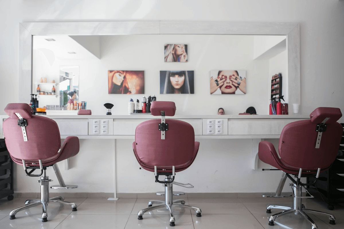 Beauty professionals working in a modern salon